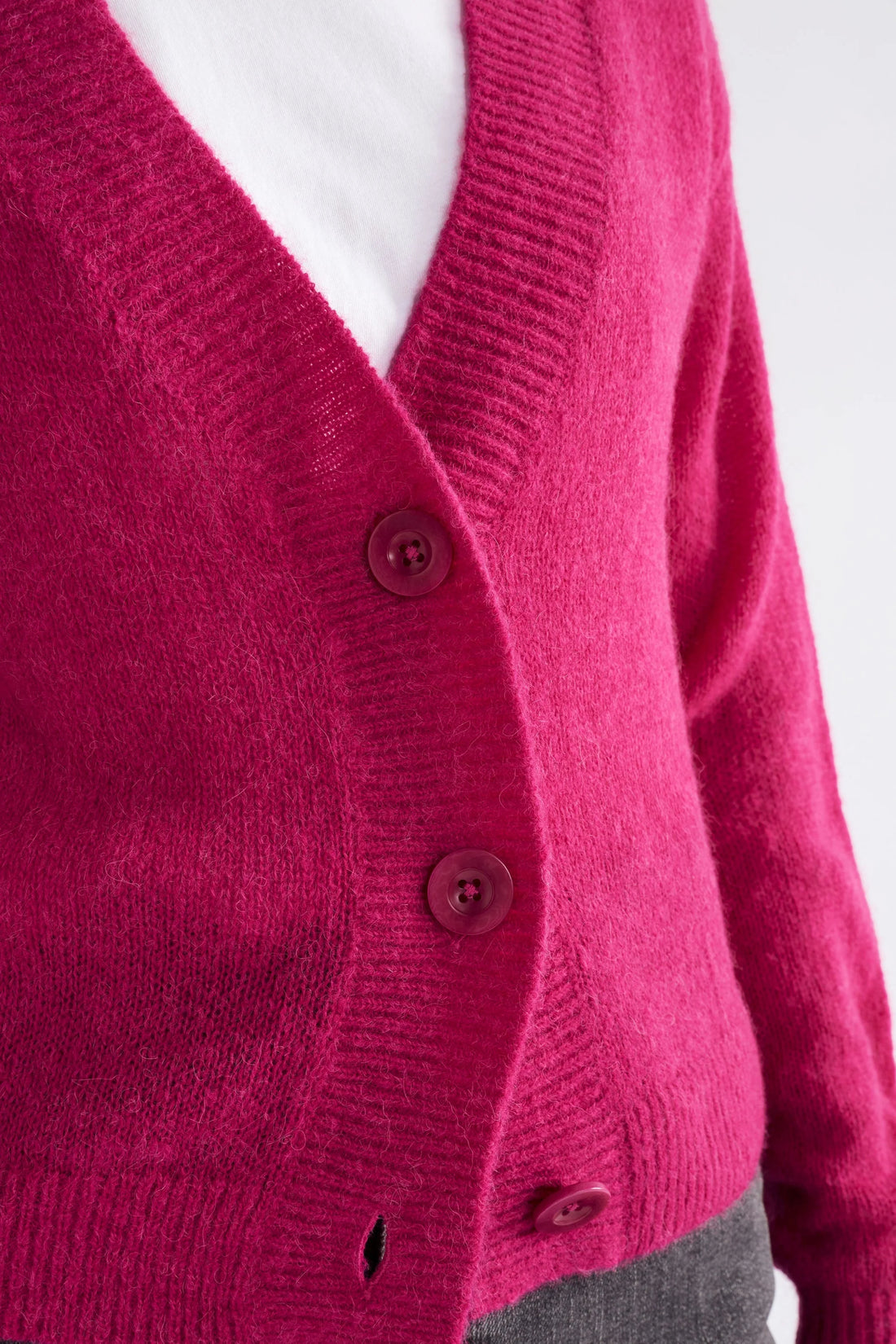 Closer look of the Daru Cardigan in Bright pink details and buttons