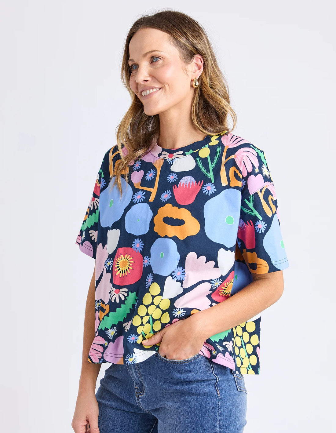 Woman wearing Flower Medley Tee - Multi and denim pants
