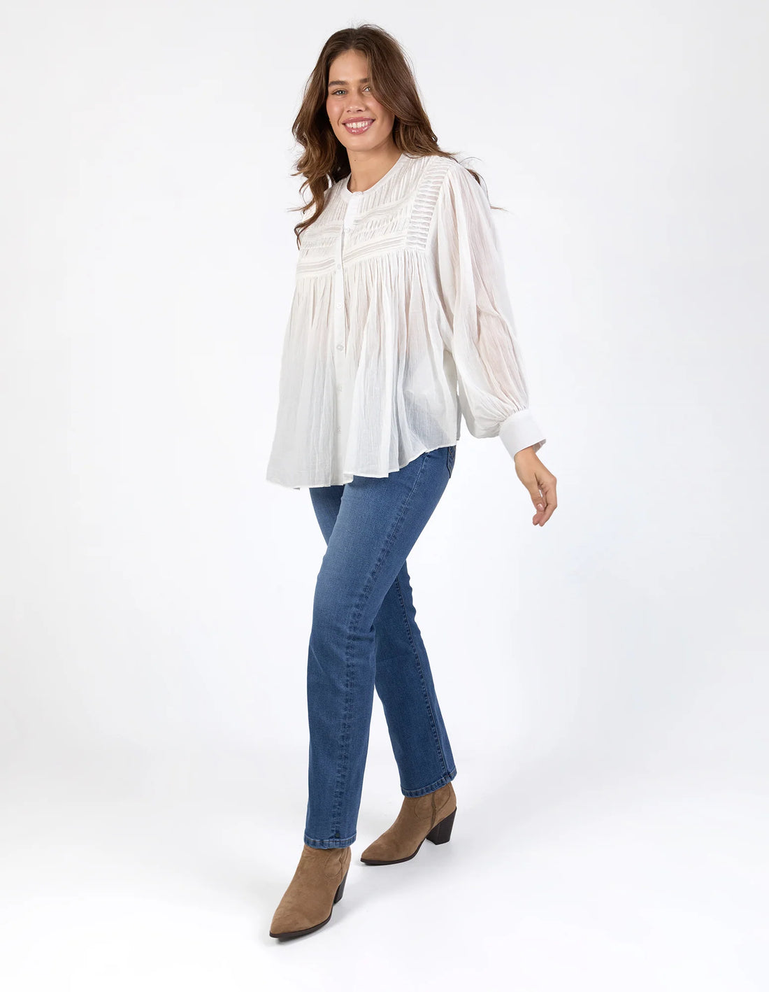Woman wearing Montana Blouse - Marshmallow and denim pants side view