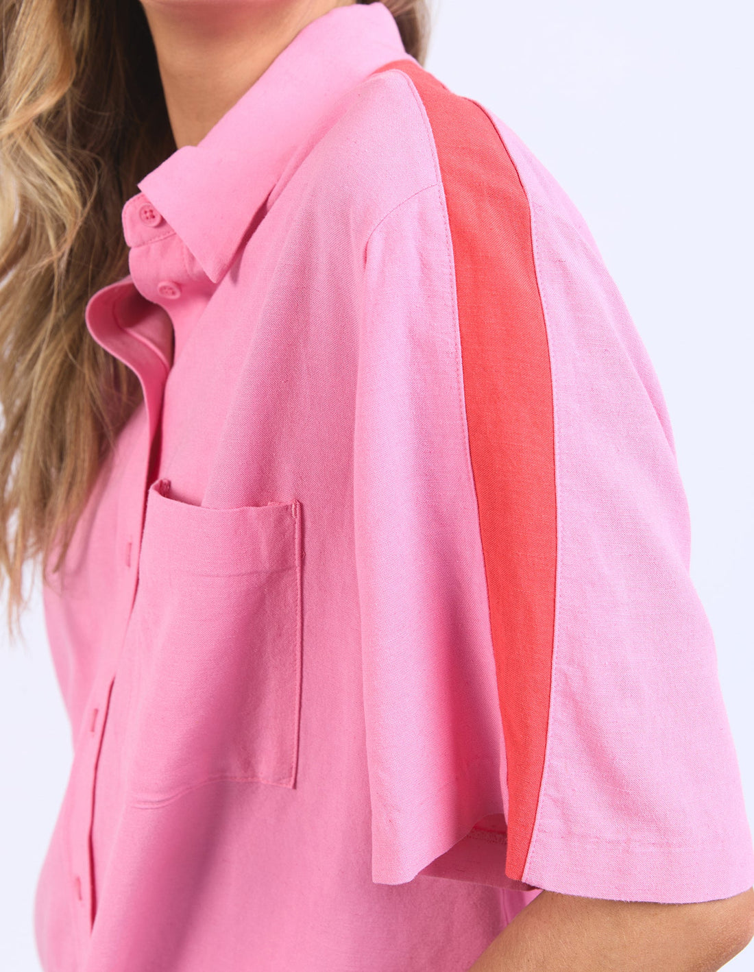 Closer look of shirt sleeve detail of elm lifestyle frances stripe in strawberry pink