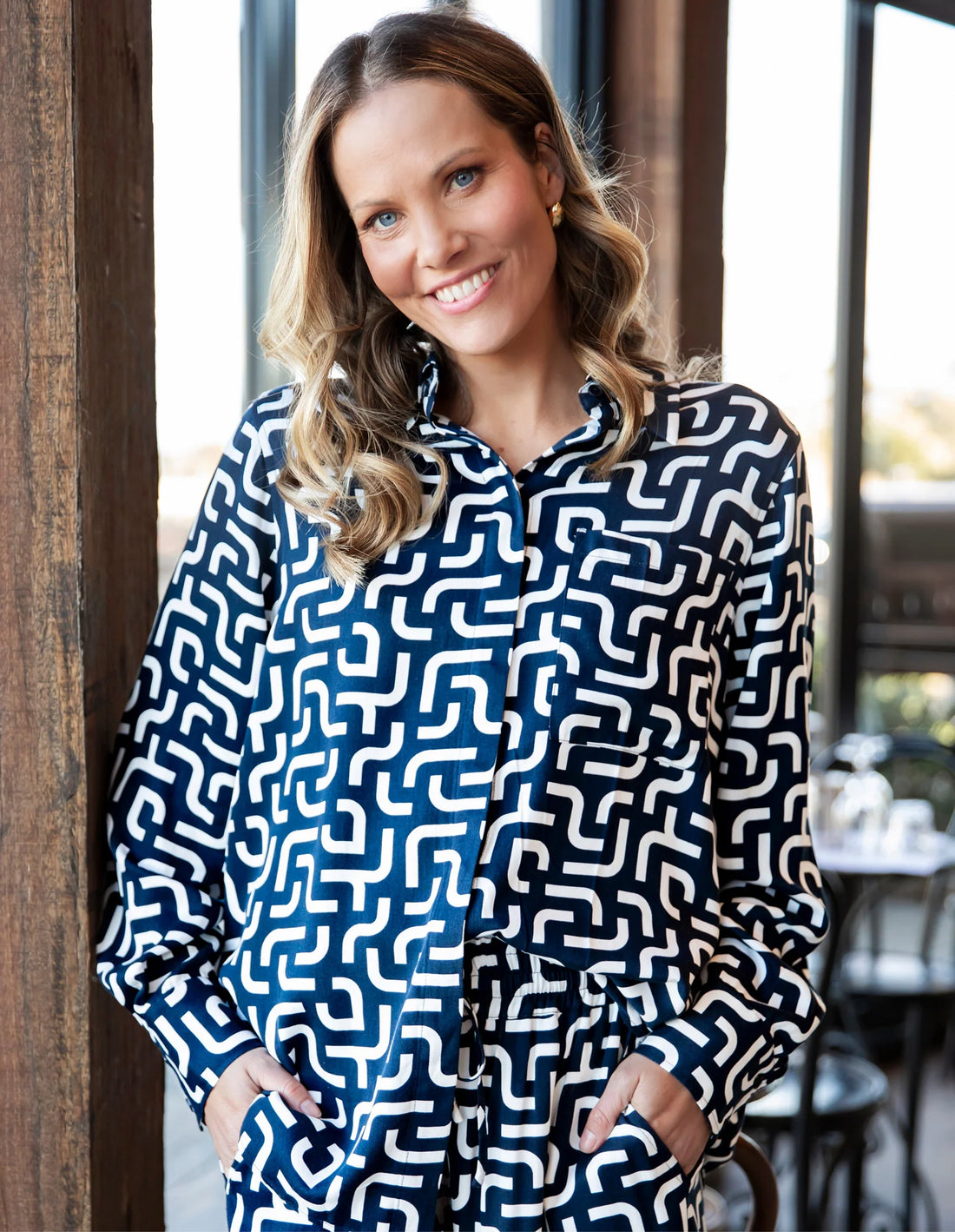 Woman wearing Gemma Geo Shirt - Navy hand in the pocket