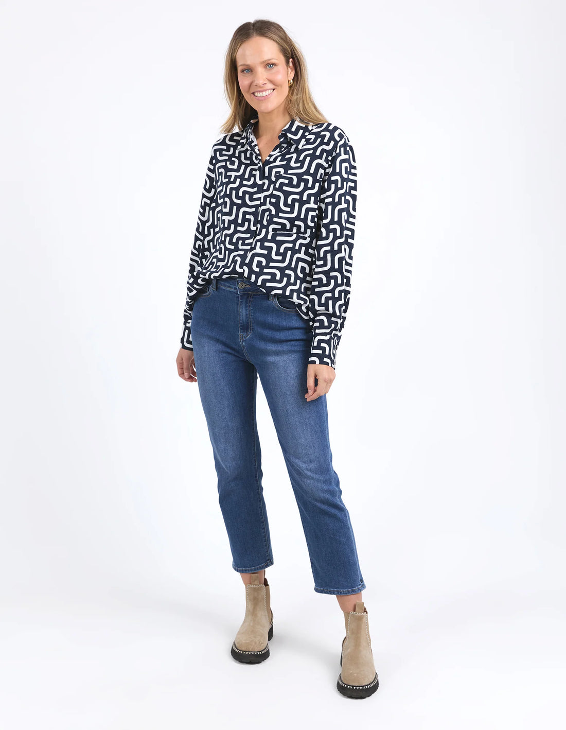 Woman wearing Gemma Geo Shirt - Navy and denim pants