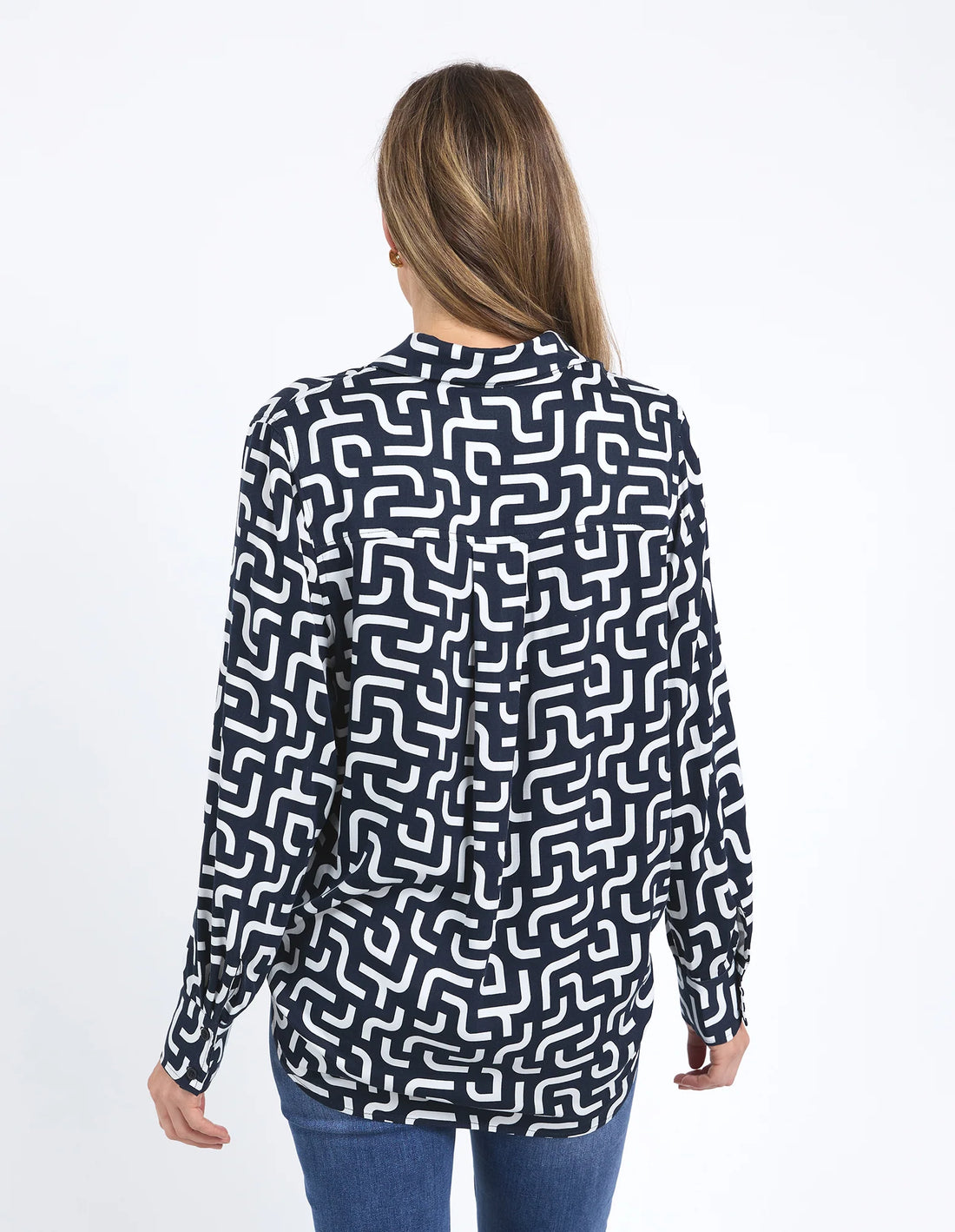 woman facing the back wearing Gemma Geo Shirt - Navy and denim pants