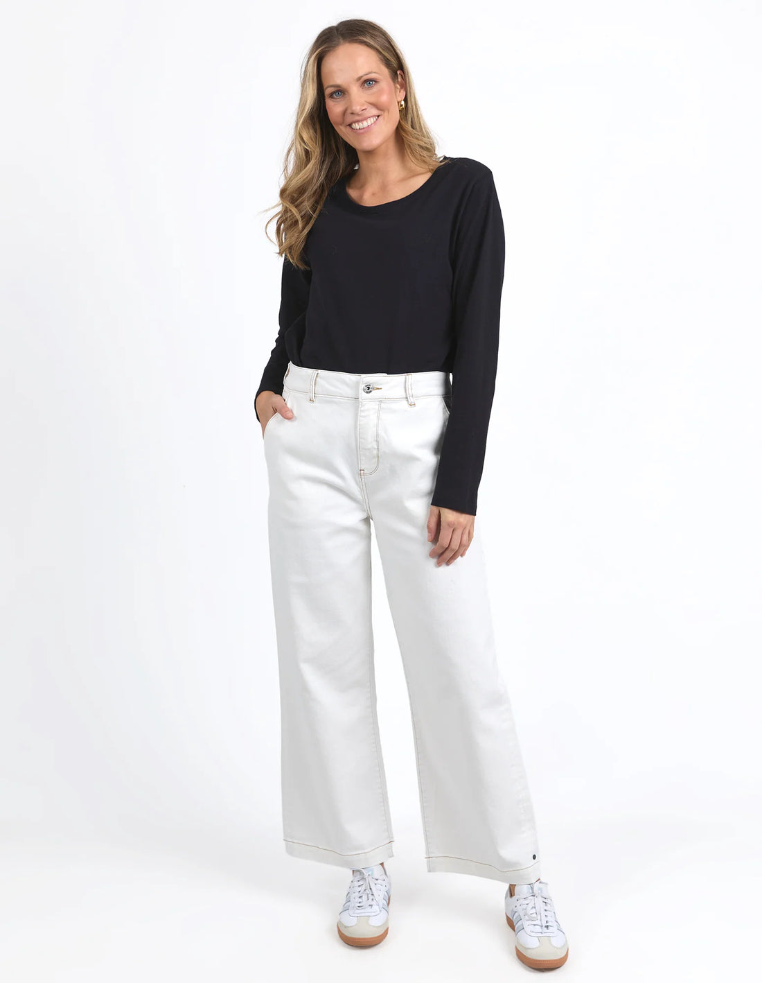 Woman wearing Vintage white Izzy Wide Leg Jean and black long sleeve top