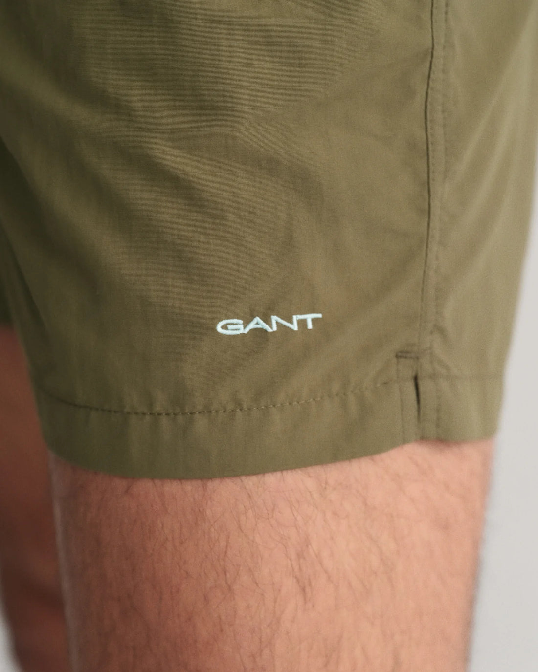 Gant embroidery near the hem of basic swim shorts juniper green