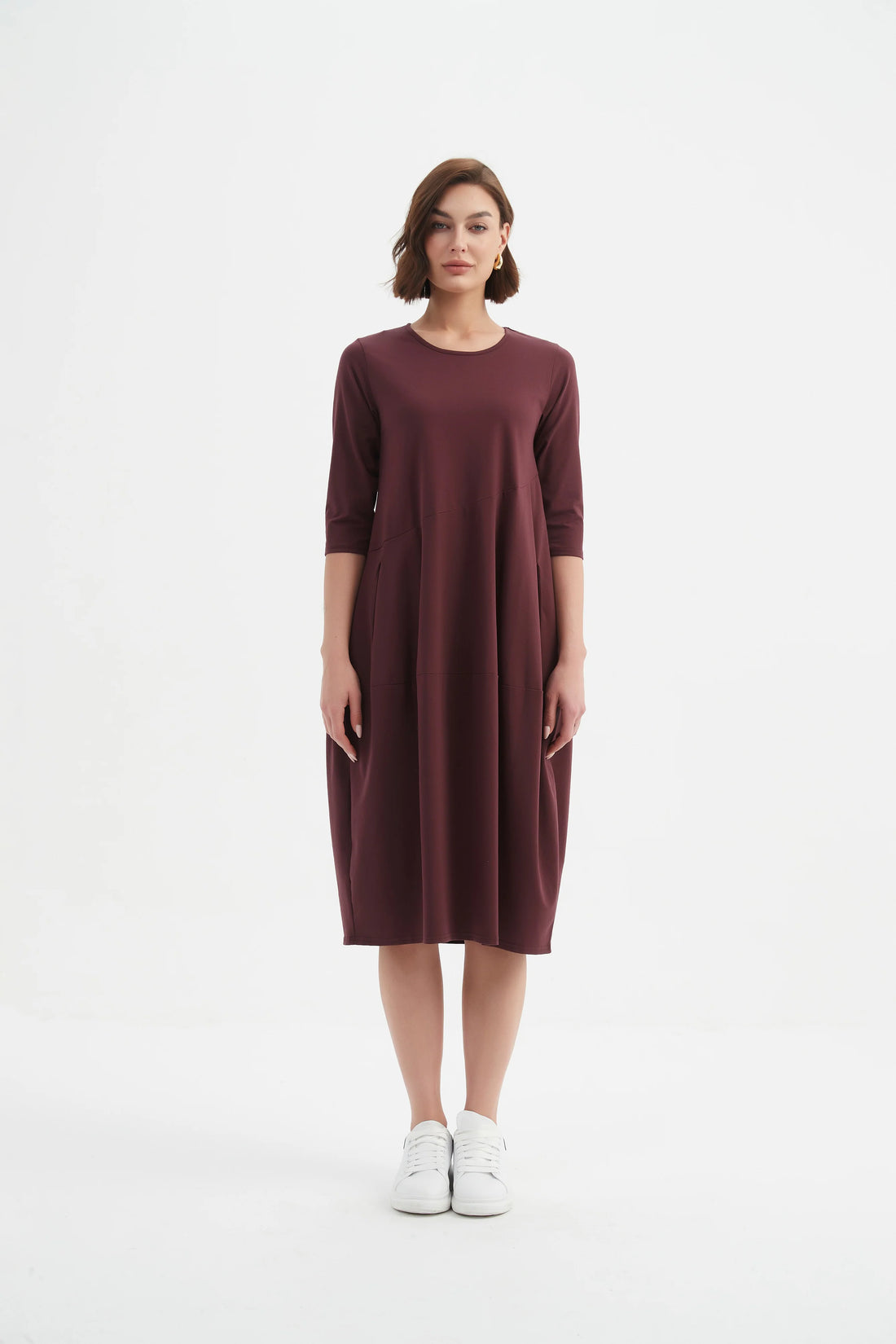 Woman wearing Diagonal Seam Winter Dress - Aubergine and white shoes