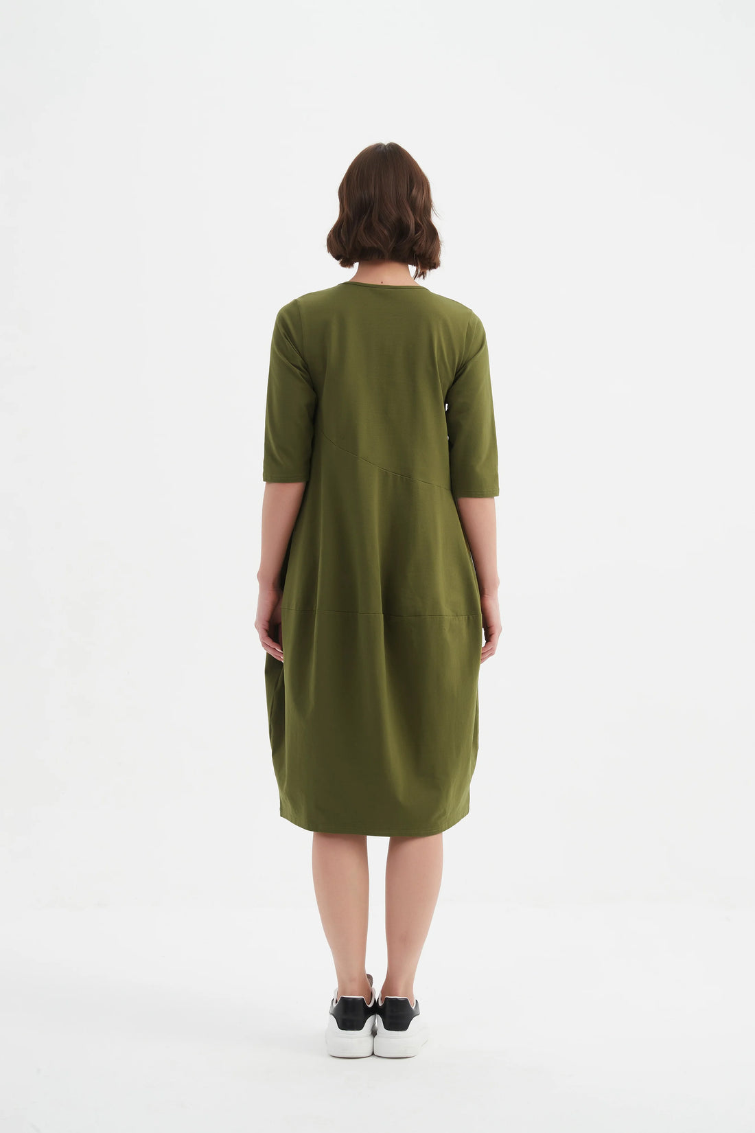 Woman wearing Diagonal Seam Winter Dress - Khaki facing the back