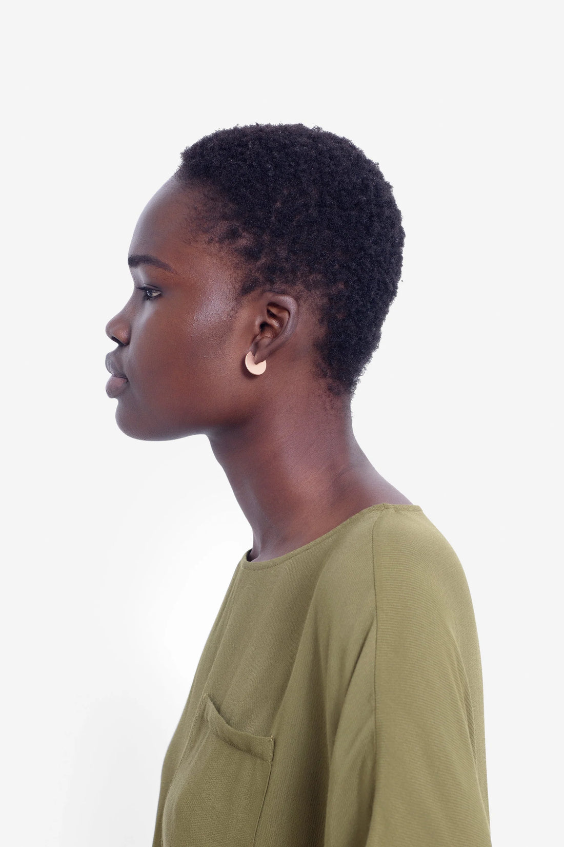 woman wearing green top and elk vivi earring in gold