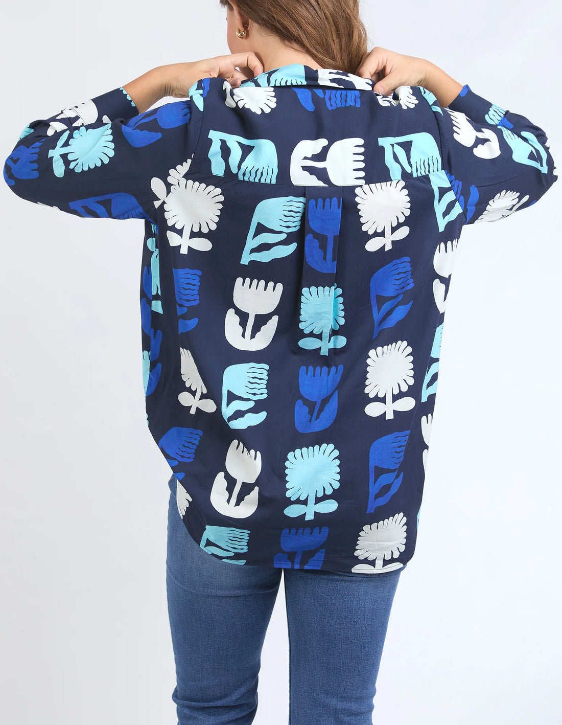 woman wearing Madeline Stamer Shirt - Navy and denim pants back view