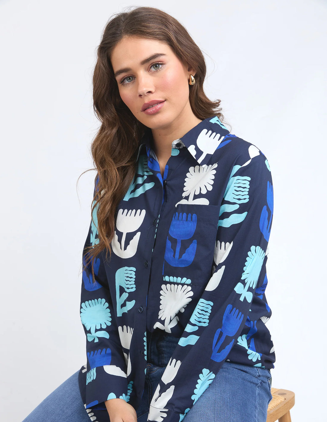 woman wearing Madeline Stamer Shirt - Navy and denim pants