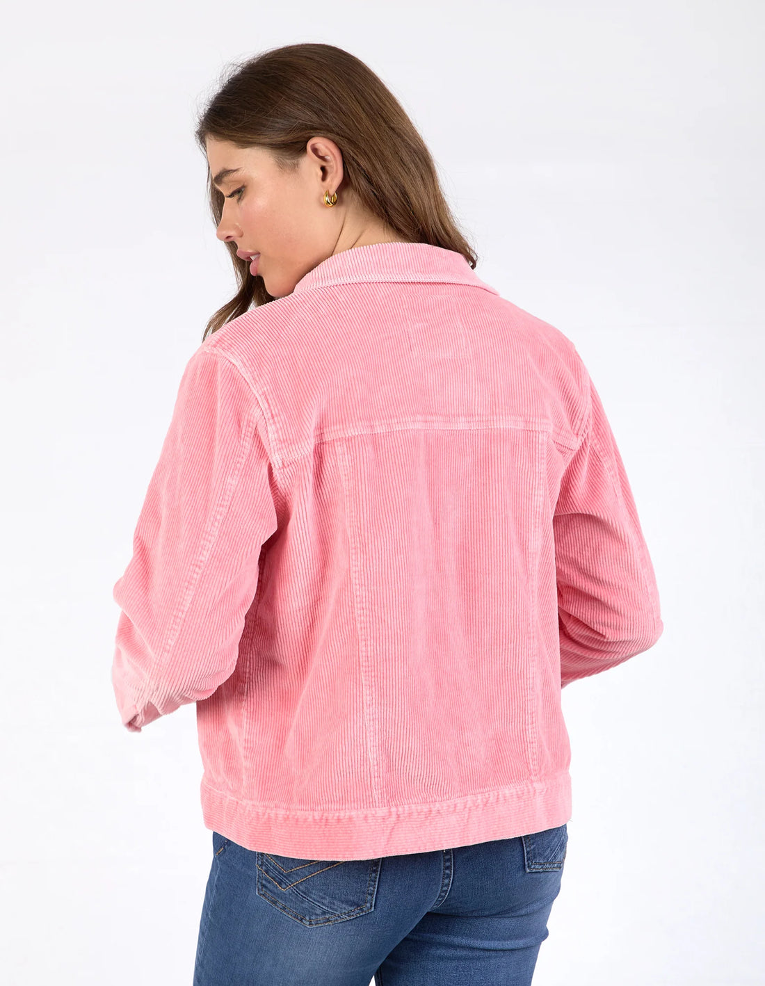 woman facing the back wearing denim jeans and Fleur Cord Jacket Charm Pink