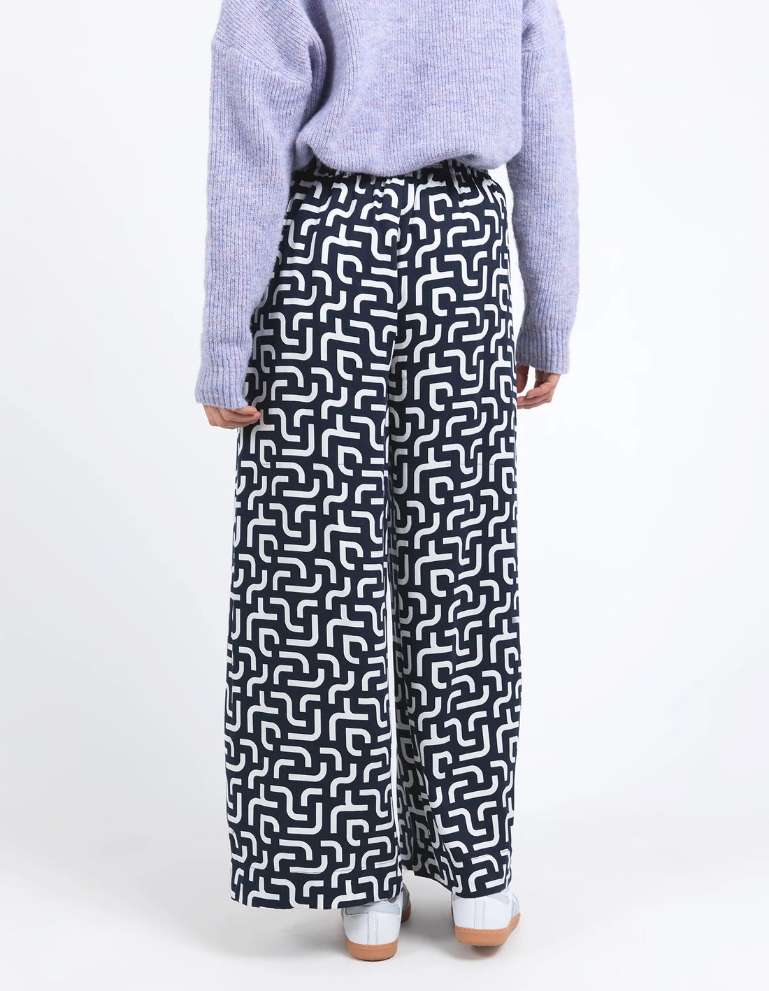 woman facing the back Gemma Geo Pant - Navy and purple top