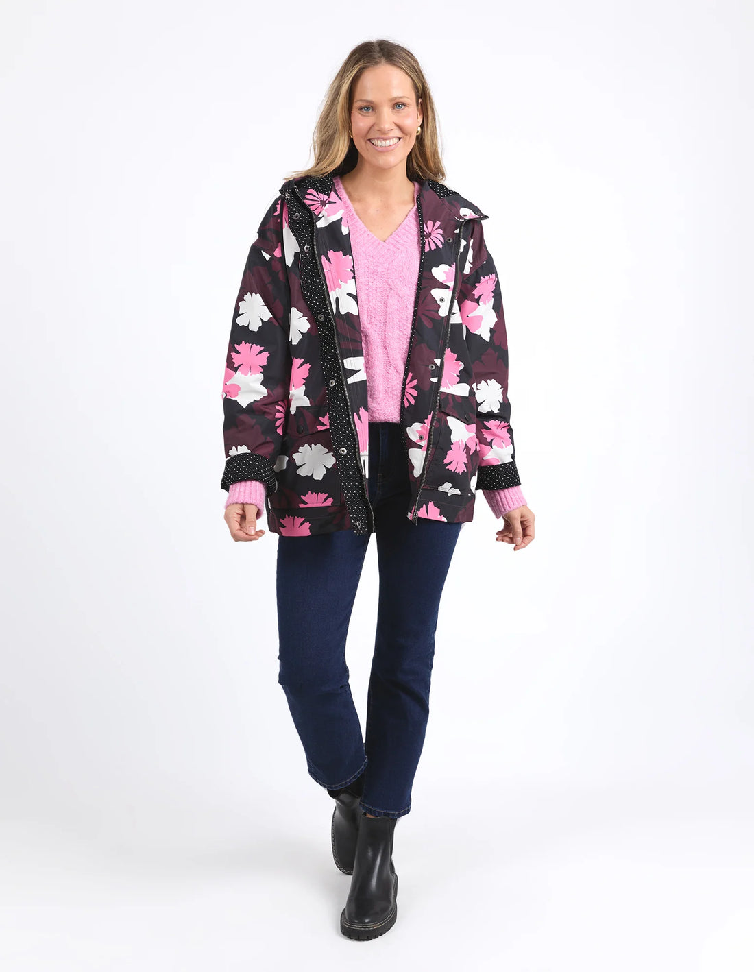 woman wearing pink top, Hadley Floral Raincoat and denim pants