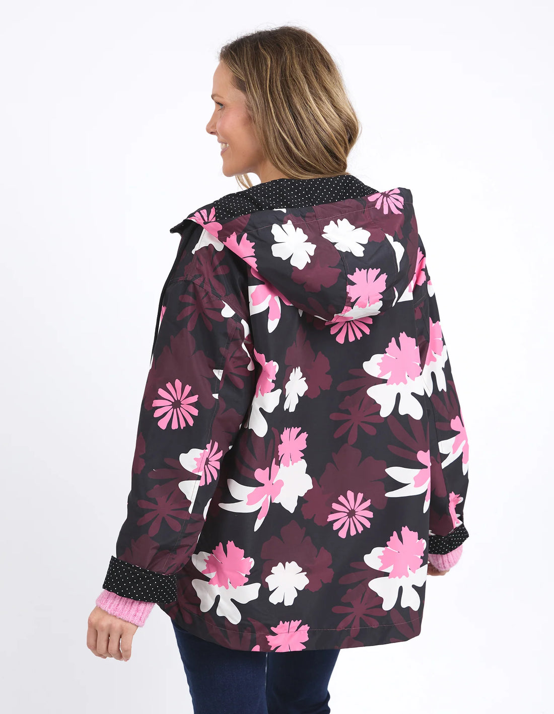 woman facing the back wearing Hadley Floral Raincoat and denim pants