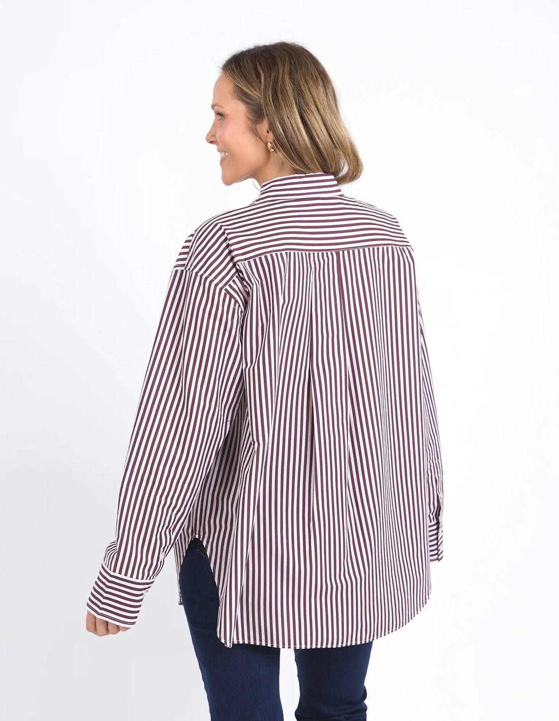 woman facing the back wearing Lila Stripe Shirt - Merlot White Stripe and denim pants
