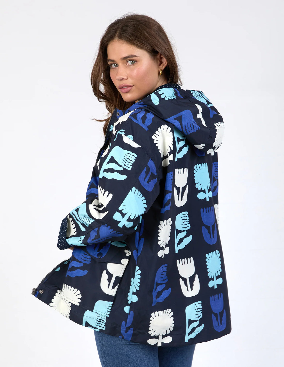 woman wearing Madeline Stamer Raincoat - Navy and denim pants back view