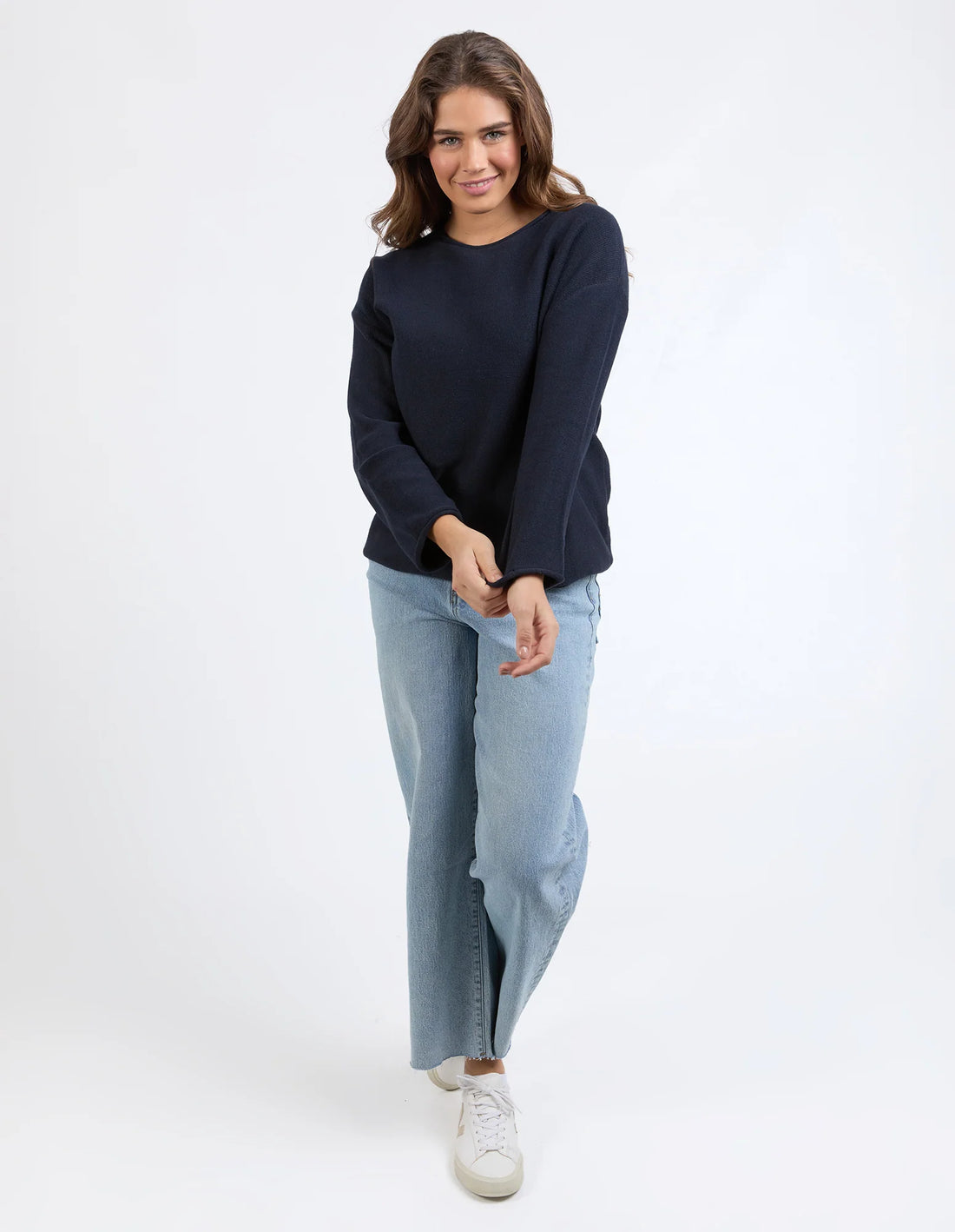 woman wearing Marley Knit - Dark Sapphire and denim pants front view