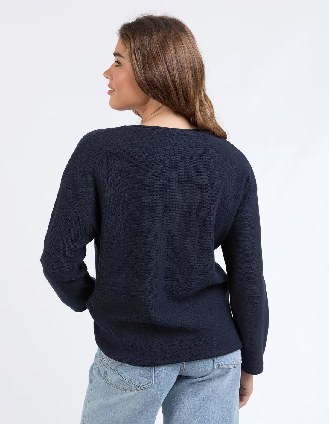 woman wearing Marley Knit - Dark Sapphire and denim pants back view