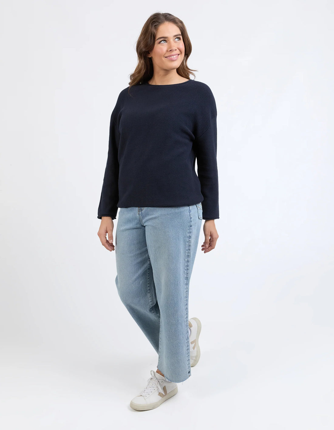 woman wearing Marley Knit - Dark Sapphire and denim pants
