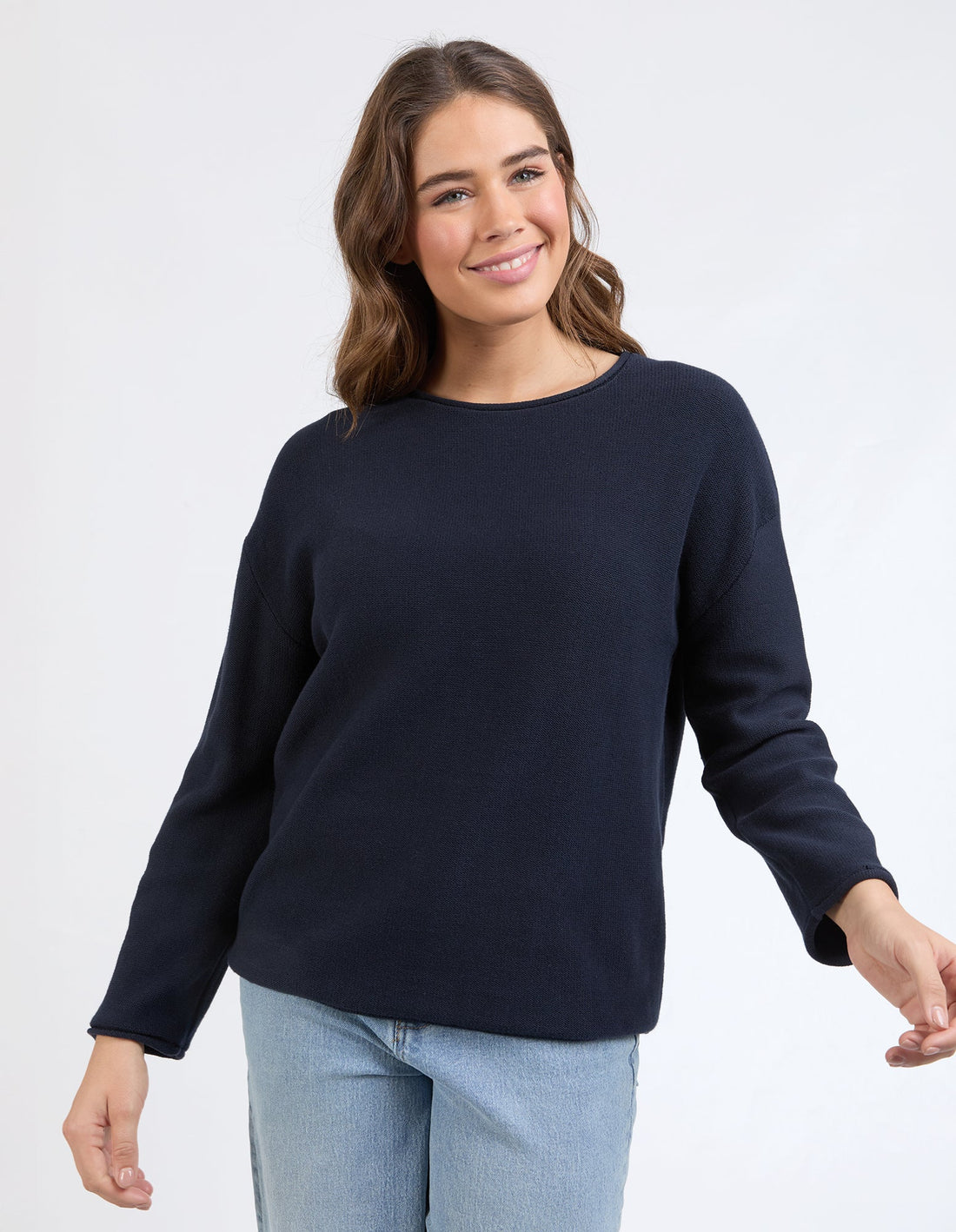 woman wearing Marley Knit - Dark Sapphire and denim pants