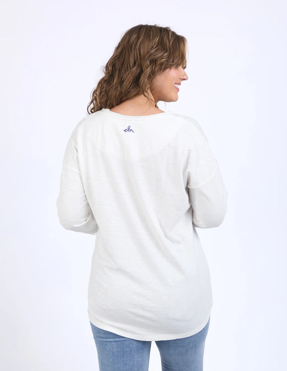 woman facing the back wearing Outlook Sweat - Marshmallow and denim pants