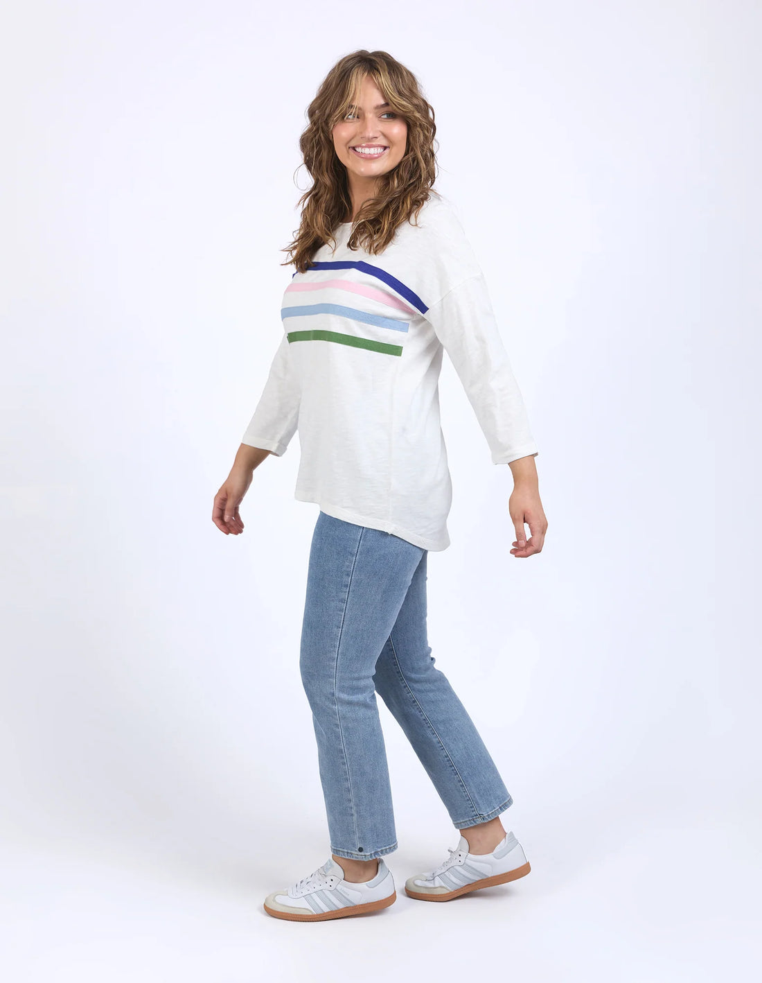 woman sitting wearing Outlook Sweat - Marshmallow and denim pants