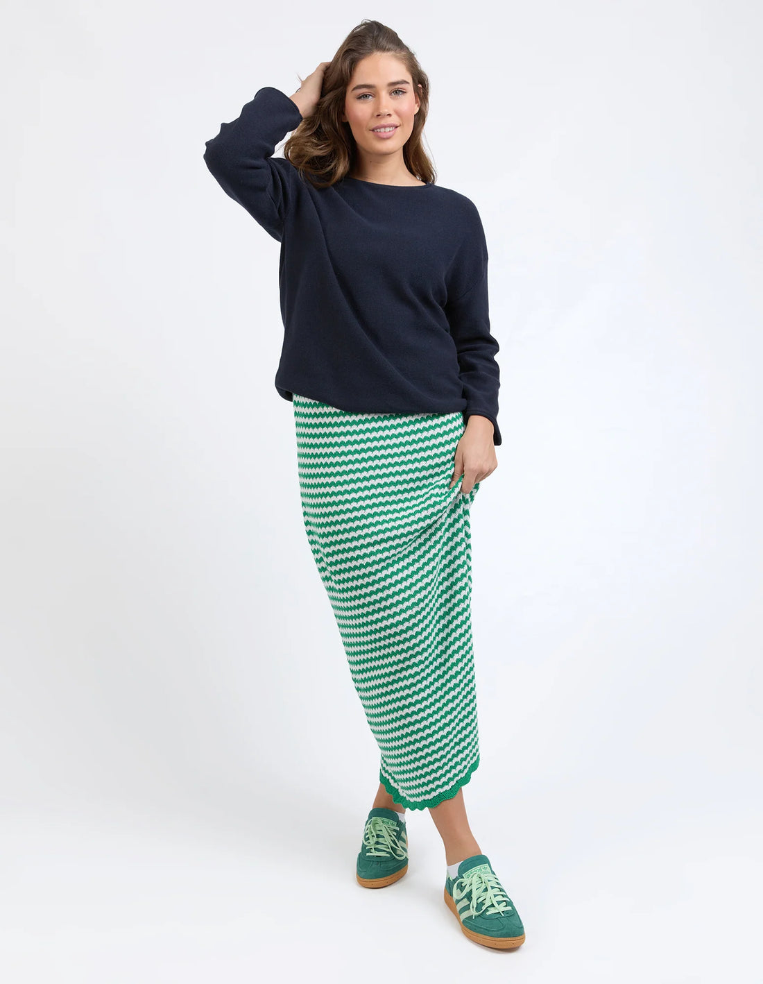 woman wearing navy jumper and Rosie Stripe Skirt - Pine Green front view