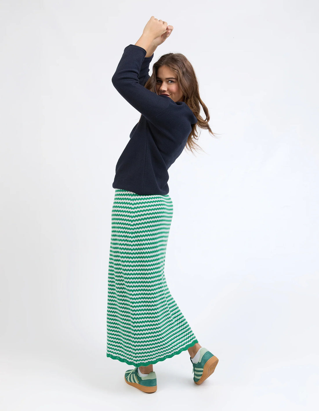 woman wearing navy jumper and Rosie Stripe Skirt - Pine Green back view