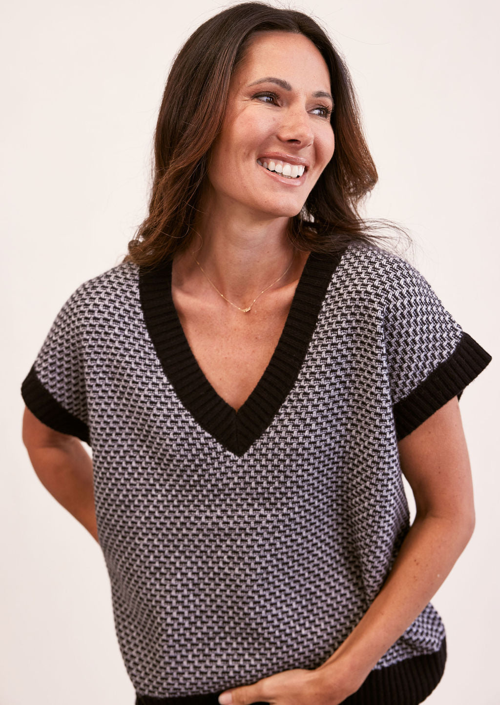 woman wearing  V Neck Knit Vest - Black/Silver