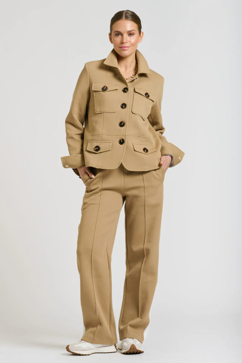 Woman wearing Pants and Hemming Scuba Jacket both in Caramel