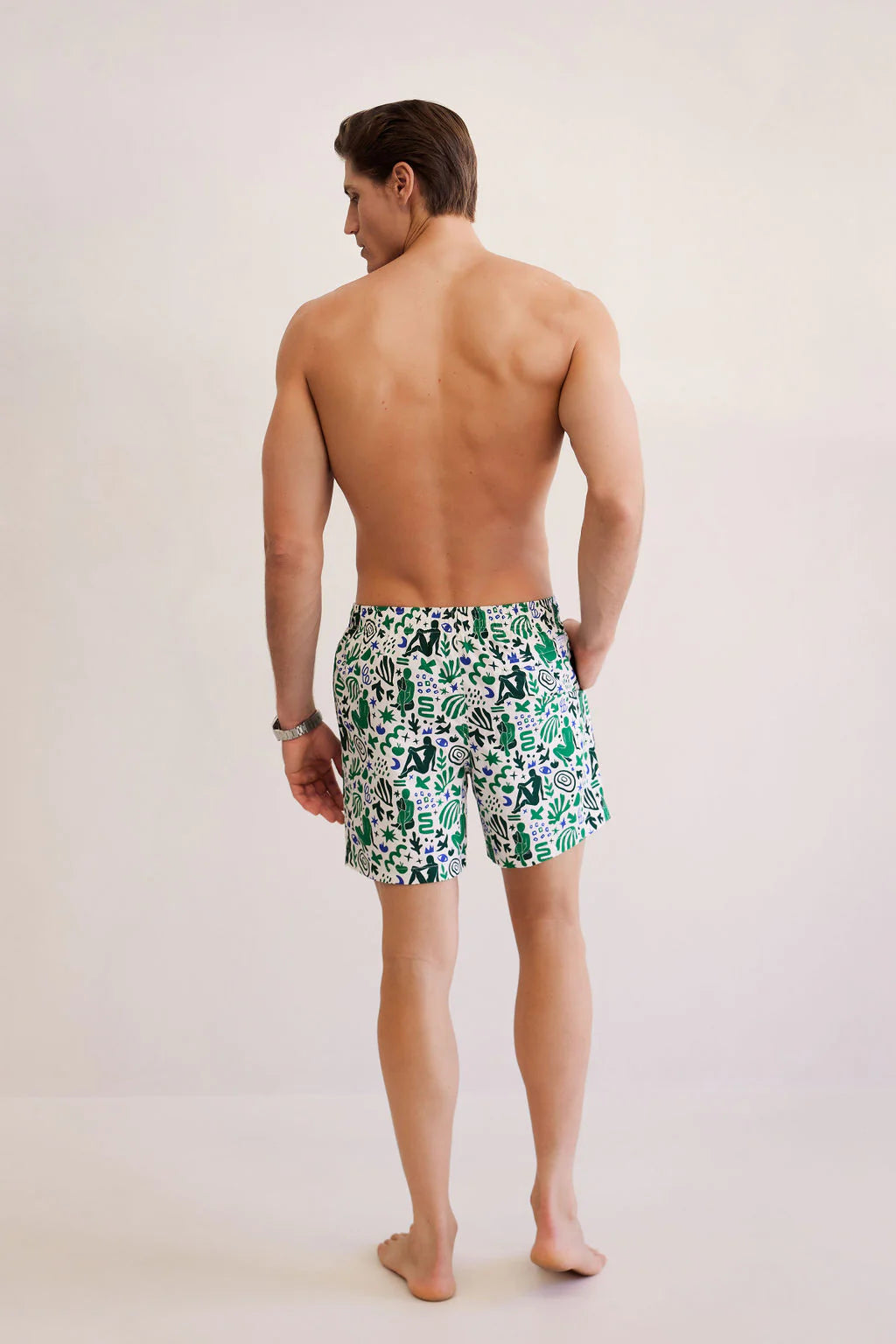 man facing the back wearing shore club swim means swim short in corsica design