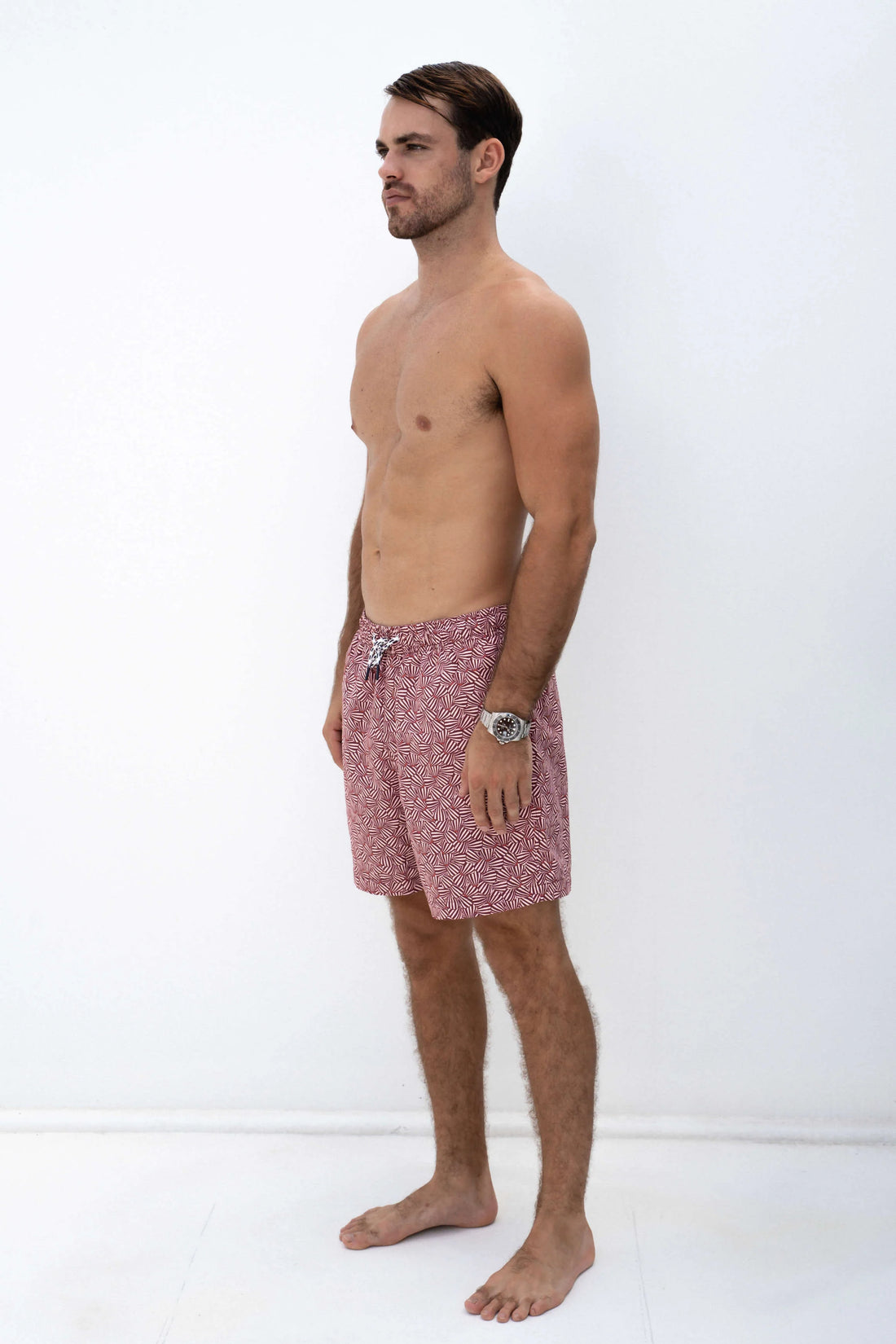 man wearing shore club swim means swim short in st barts design