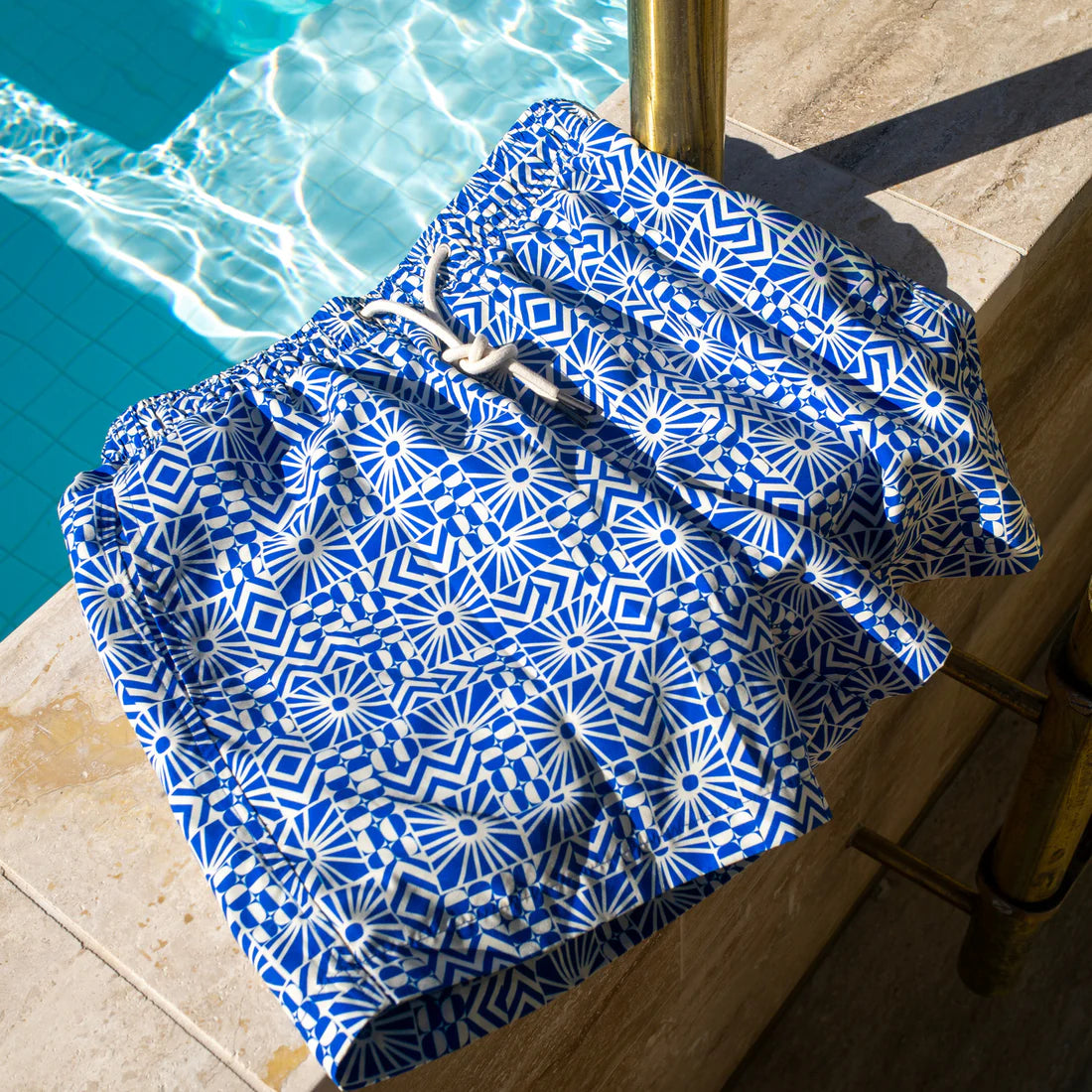 shore club swim mens swim short in mediterranean sun design beside the pool